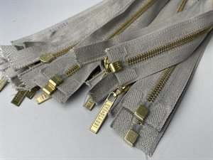 Delbar lynlås - sølv glimmer med guld metaltænder, 66 cm
